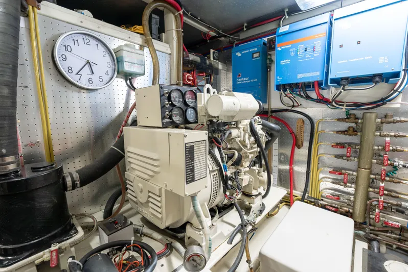 Si Como No Yacht Photos Pics Engine room of 2009 DeFever 45 Motoryacht with generator and electrical systems.