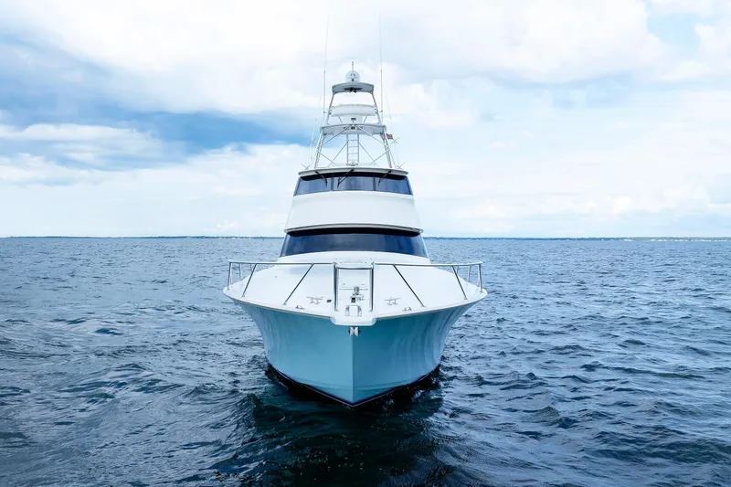 On Ice Yacht Photos Pics 2009 Viking 74 Enclosed Bridge yacht on open sea, front view.