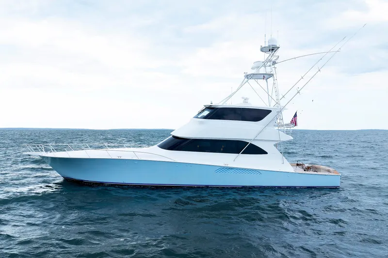 On Ice Yacht Photos Pics 2009 Viking 74 Enclosed Bridge yacht on open sea, side view.