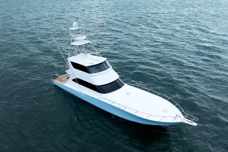 On Ice Yacht Photos Pics 2009 Viking 74 Enclosed Bridge yacht on open water, aerial view.