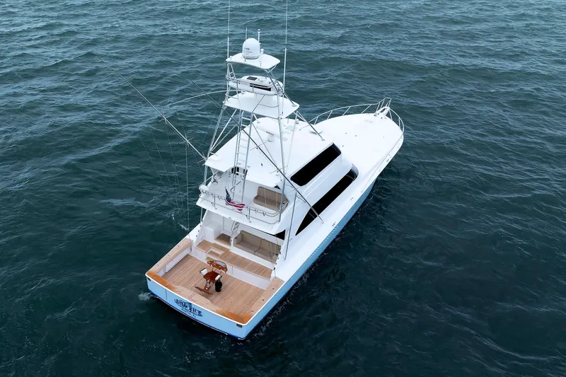 On Ice Yacht Photos Pics 2009 Viking 74 Enclosed Bridge yacht cruising on open water.