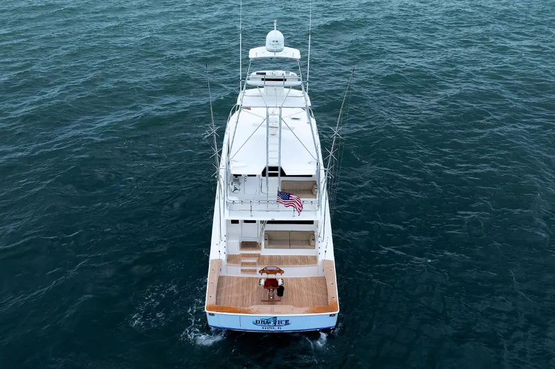 On Ice Yacht Photos Pics Aerial view of 2009 Viking 74 Enclosed Bridge yacht cruising on open water.