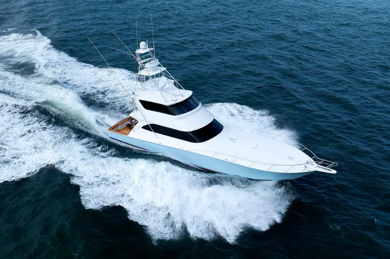 On Ice Yacht Photos Pics 2009 Viking 74 Enclosed Bridge yacht cruising on open ocean waters.