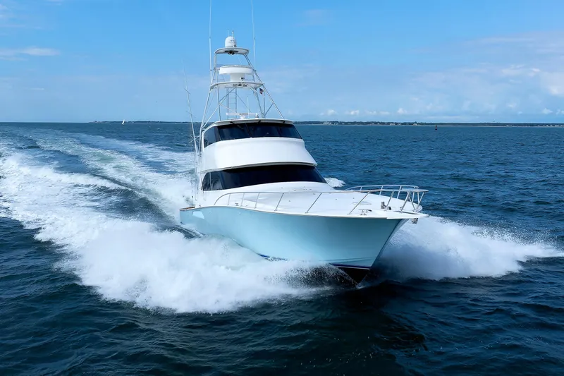 On Ice Yacht Photos Pics 2009 Viking 74 Enclosed Bridge yacht cruising on open sea.