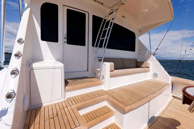 On Ice Yacht Photos Pics Luxurious 2009 Viking 74 Enclosed Bridge yacht deck with seating and ocean view.