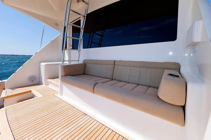 On Ice Yacht Photos Pics Luxurious seating area on 2009 Viking 74 Enclosed Bridge yacht with ocean view.