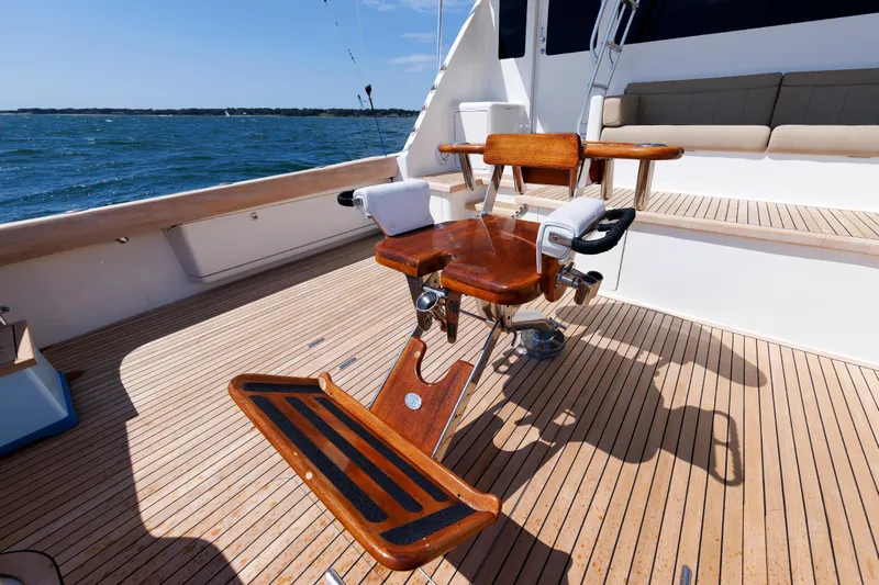 On Ice Yacht Photos Pics Luxury fishing chair on 2009 Viking 74 Enclosed Bridge yacht deck, ocean view.