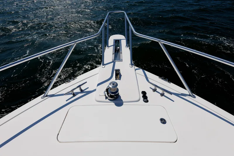 On Ice Yacht Photos Pics Bow of 2009 Viking 74 Enclosed Bridge yacht on open water.