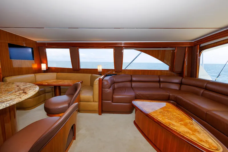 On Ice Yacht Photos Pics Luxurious interior of 2009 Viking 74 Enclosed Bridge yacht with leather seating and ocean view.
