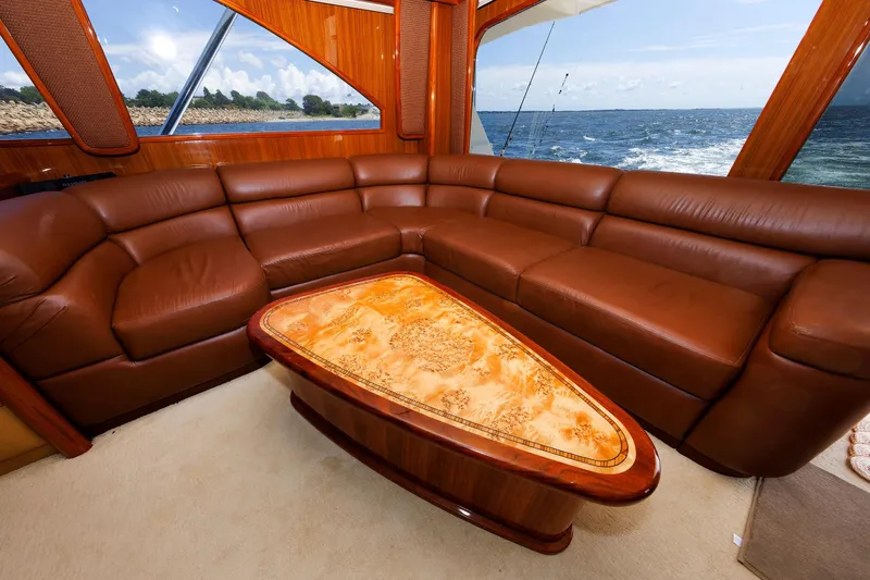 On Ice Yacht Photos Pics Luxurious interior of 2009 Viking 74 Enclosed Bridge yacht with leather seating and ocean view.