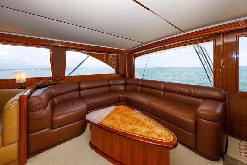 On Ice Yacht Photos Pics Luxurious interior of 2009 Viking 74 Enclosed Bridge yacht with leather seating and ocean view.