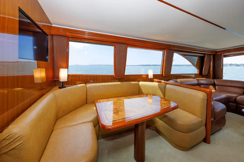 On Ice Yacht Photos Pics Luxurious interior of 2009 Viking 74 Enclosed Bridge yacht with elegant seating and ocean view.