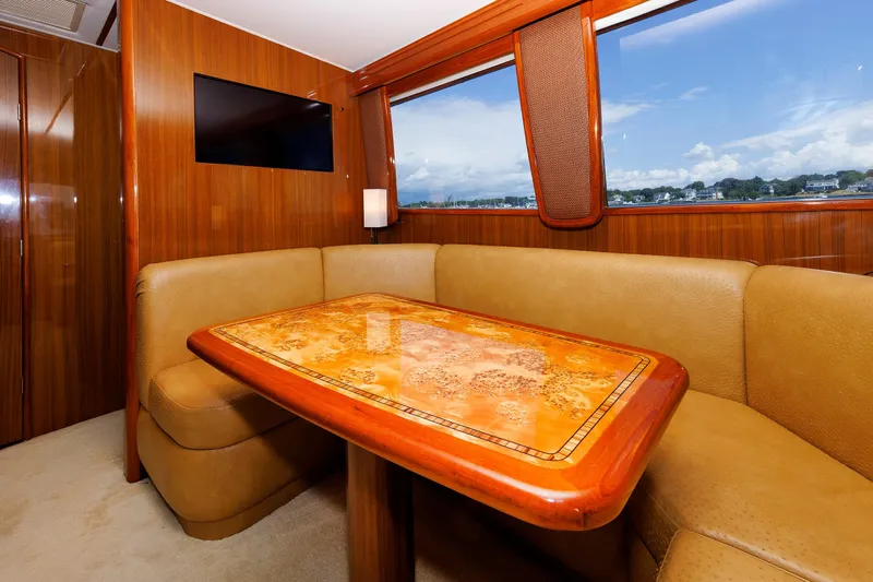 On Ice Yacht Photos Pics Luxurious interior of 2009 Viking 74 Enclosed Bridge yacht with elegant wood finishes.