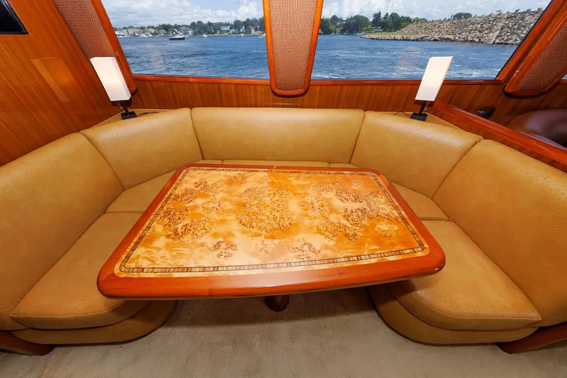 On Ice Yacht Photos Pics Luxurious dining area on 2009 Viking 74 Enclosed Bridge yacht with scenic water view.