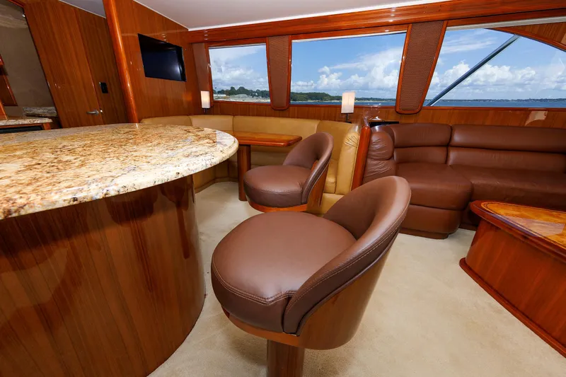 On Ice Yacht Photos Pics Luxurious interior of 2009 Viking 74 Enclosed Bridge yacht with leather seating and granite countertops.