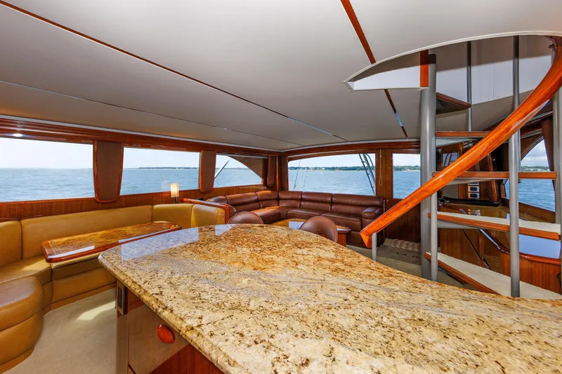 On Ice Yacht Photos Pics Luxurious interior of 2009 Viking 74 Enclosed Bridge yacht with elegant seating and ocean view.