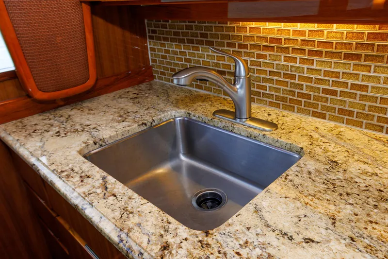 On Ice Yacht Photos Pics Luxury yacht kitchen sink with granite countertop, Viking 74 Enclosed Bridge, 2009 model.