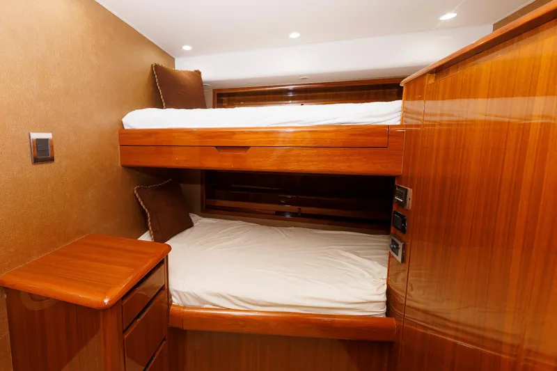On Ice Yacht Photos Pics Luxurious wooden bunk beds in 2009 Viking 74 Enclosed Bridge yacht cabin.