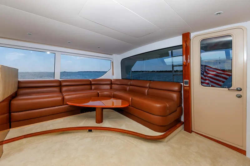 On Ice Yacht Photos Pics Luxurious interior of 2009 Viking 74 Enclosed Bridge yacht with leather seating and ocean view.