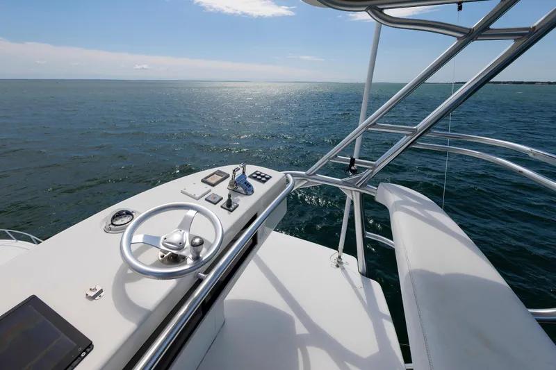 On Ice Yacht Photos Pics 2009 Viking 74 Enclosed Bridge yacht helm overlooking open sea.