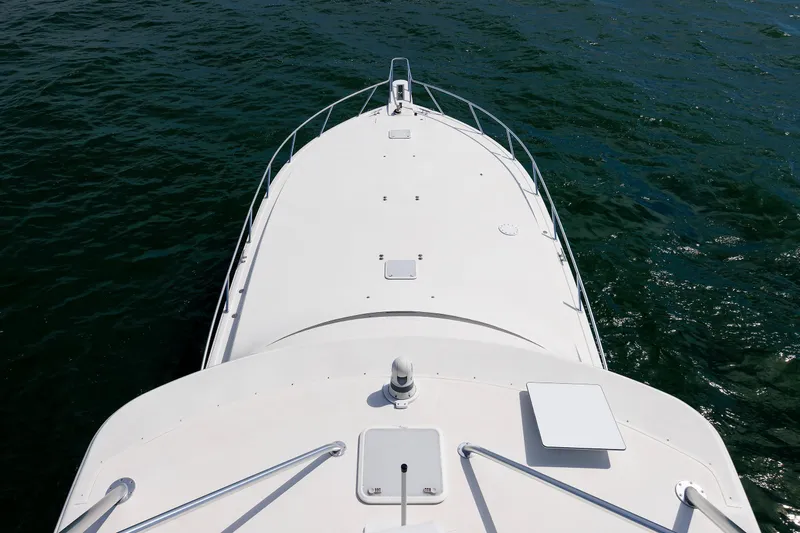 On Ice Yacht Photos Pics Bow view of 2009 Viking 74 Enclosed Bridge yacht on open water.