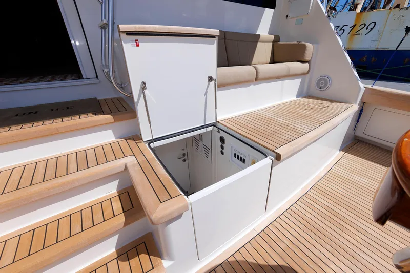 On Ice Yacht Photos Pics 2009 Viking 74 Enclosed Bridge yacht with open hatch and teak deck seating area.