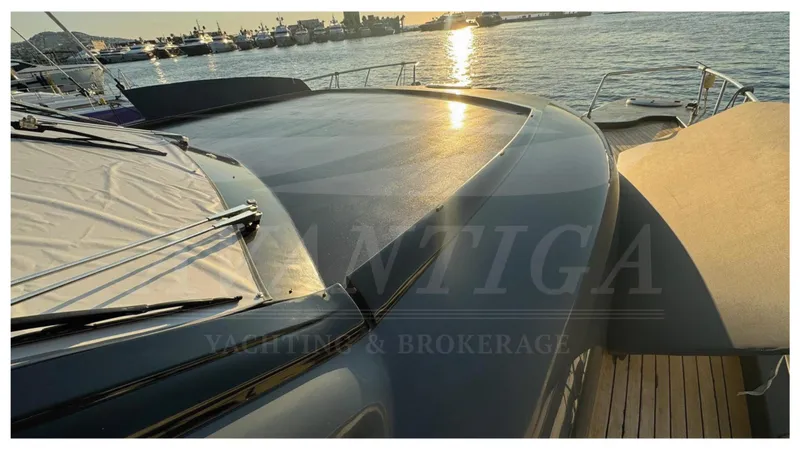  Yacht Photos Pics 2014 Catamaran Power Catamaran at sunset, docked with other boats in the background.