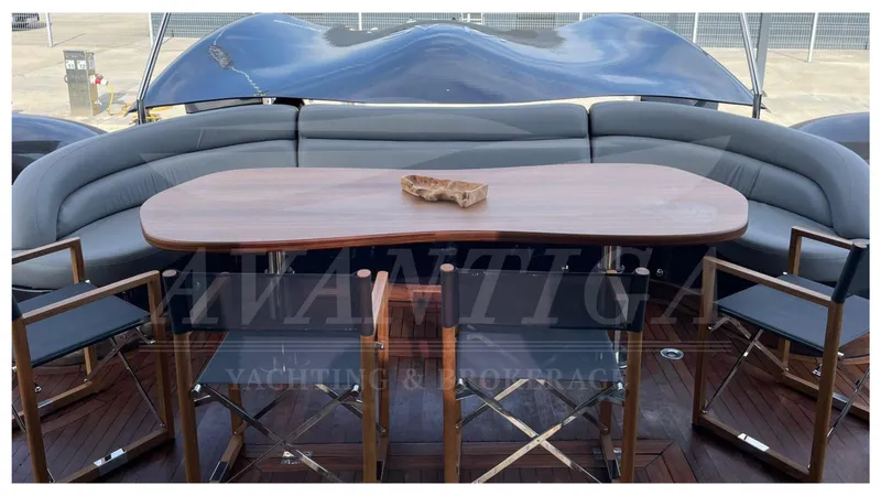 Yacht Photos Pics 2014 Catamaran Power Catamaran with elegant outdoor seating and wooden table.