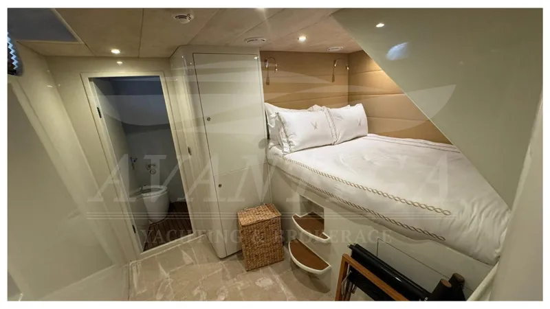  Yacht Photos Pics 2014 Catamaran Power Catamaran cabin with bed, storage, and ensuite bathroom.