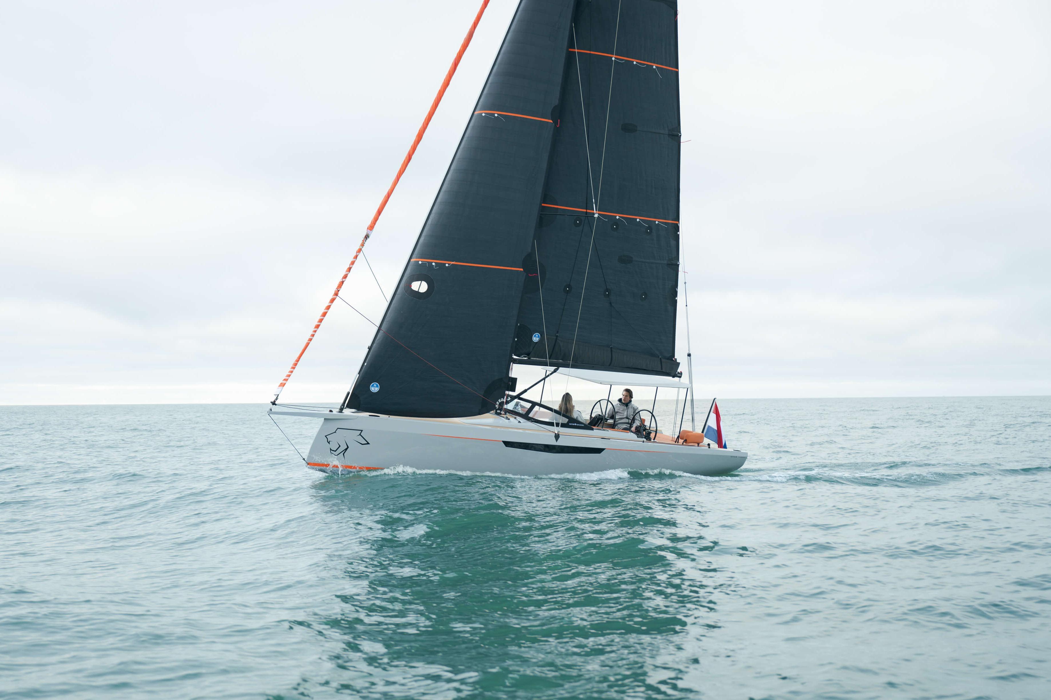 2026 Saffier SE 28 Leopard sailing on open water with sleek black sails.