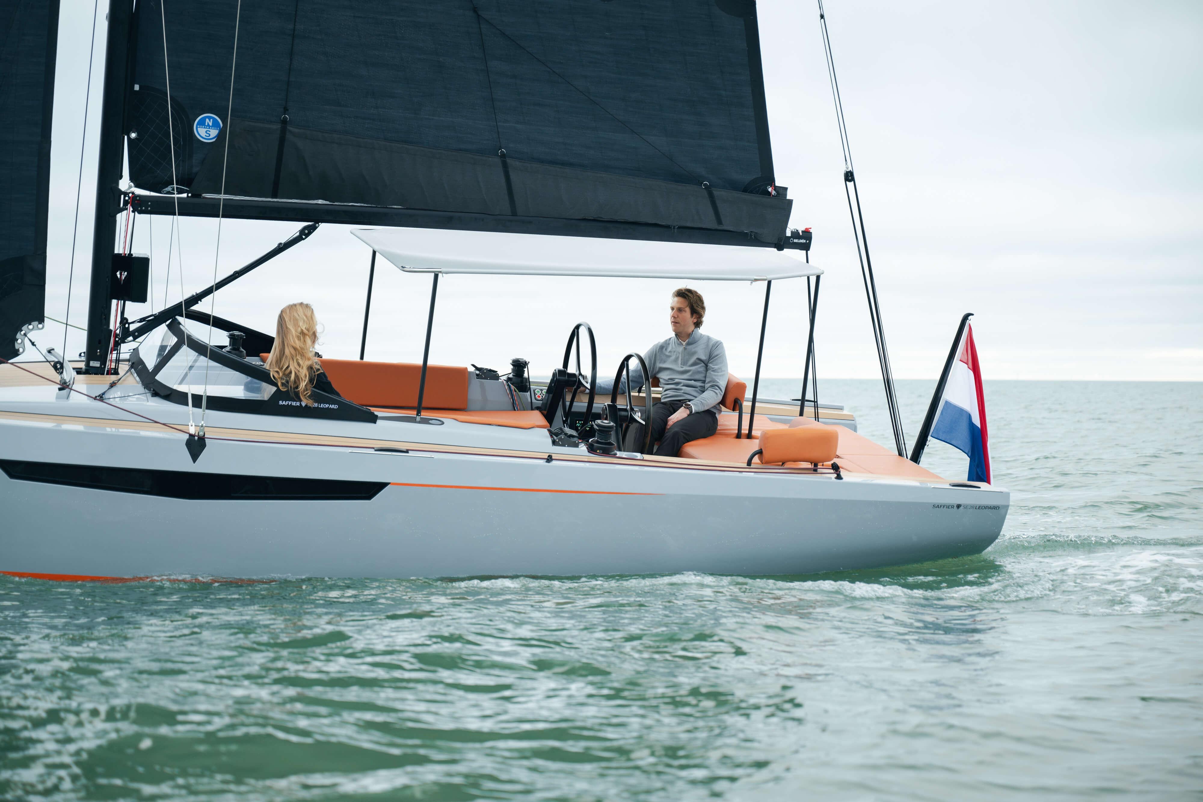 2026 Saffier SE 28 Leopard sailing on calm waters with two people onboard.