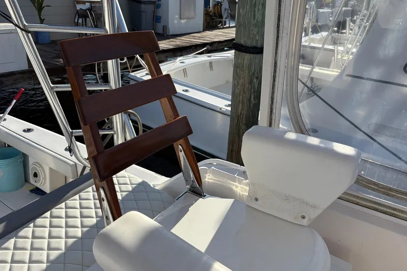 Andiamo Yacht Photos Pics 2001 Ocean 40 Express Bridge boat interior with wooden ladder and cushioned seating.