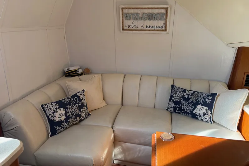 Andiamo Yacht Photos Pics Luxurious 2001 Ocean 40 Express Bridge yacht interior with cozy seating and nautical decor.