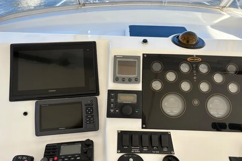 Andiamo Yacht Photos Pics 2001 Ocean 40 Express Bridge dashboard with navigation and control instruments.