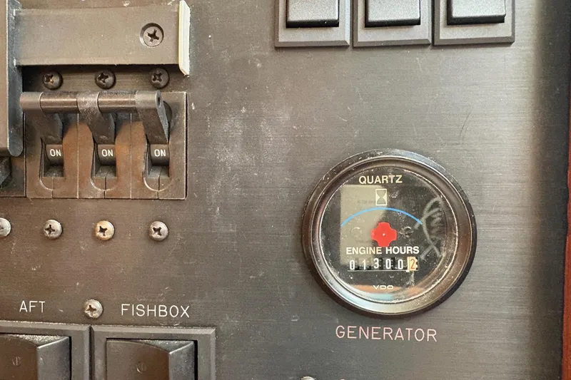 Andiamo Yacht Photos Pics Control panel of 2001 Ocean 40 Express Bridge with engine hours and switches.