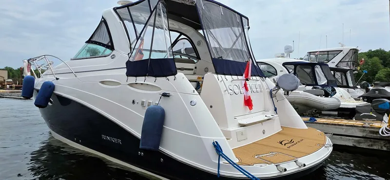  Yacht Photos Pics 2007 Rinker 350 Express yacht docked, featuring sleek design and Canadian flag.