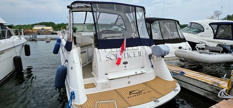  Yacht Photos Pics 2007 Rinker 350 Express yacht docked at marina with clear skies.