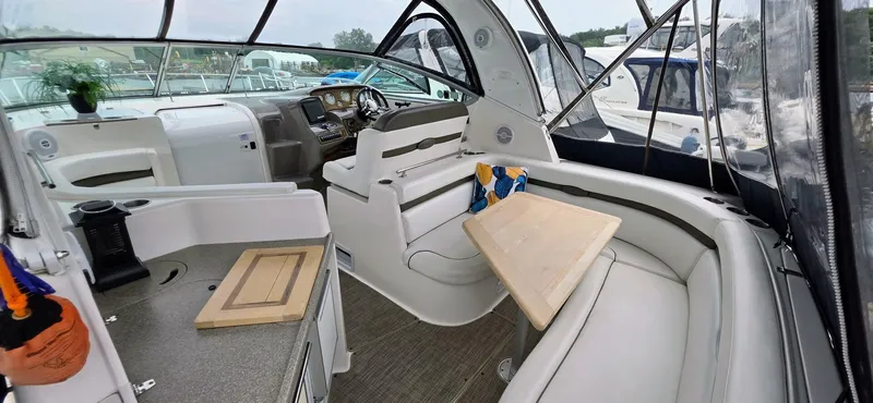  Yacht Photos Pics 2007 Rinker 350 Express boat interior with seating, table, and helm.