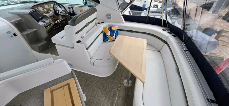  Yacht Photos Pics 2007 Rinker 350 Express boat interior with seating, table, and helm controls.
