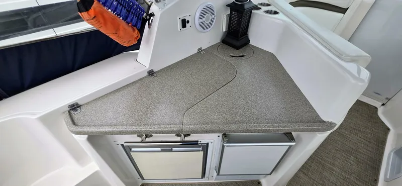  Yacht Photos Pics 2007 Rinker 350 Express boat interior with countertop and storage compartments.