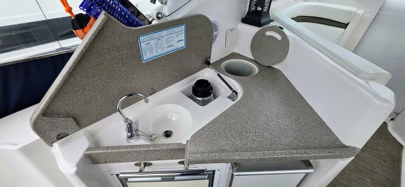  Yacht Photos Pics 2007 Rinker 350 Express boat kitchenette with sink and countertop.