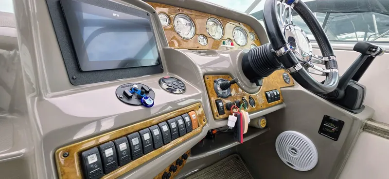  Yacht Photos Pics 2007 Rinker 350 Express boat dashboard with steering wheel and control panel.