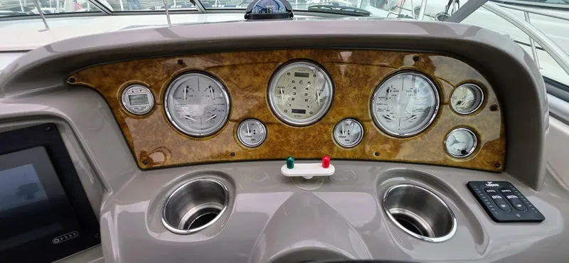  Yacht Photos Pics Dashboard of 2007 Rinker 350 Express boat with gauges and controls.