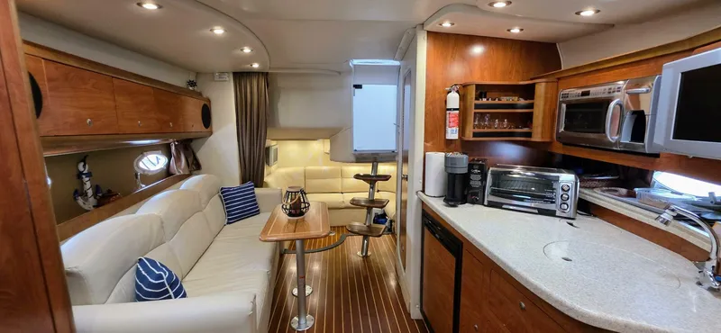  Yacht Photos Pics Luxurious 2007 Rinker 350 Express yacht interior with modern kitchen and cozy seating area.
