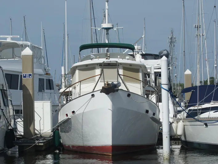 Anna Marie Yacht Photos Pics 1987 Kadey-Krogen 42 yacht docked at marina, surrounded by other boats.