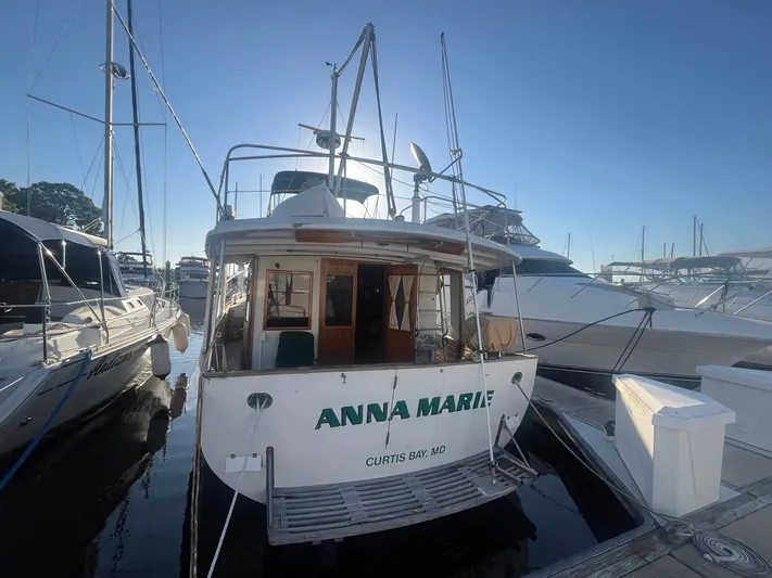 Anna Marie Yacht Photos Pics Kadey-Krogen 42 yacht, 1987 model, docked at marina, rear view with clear sky.