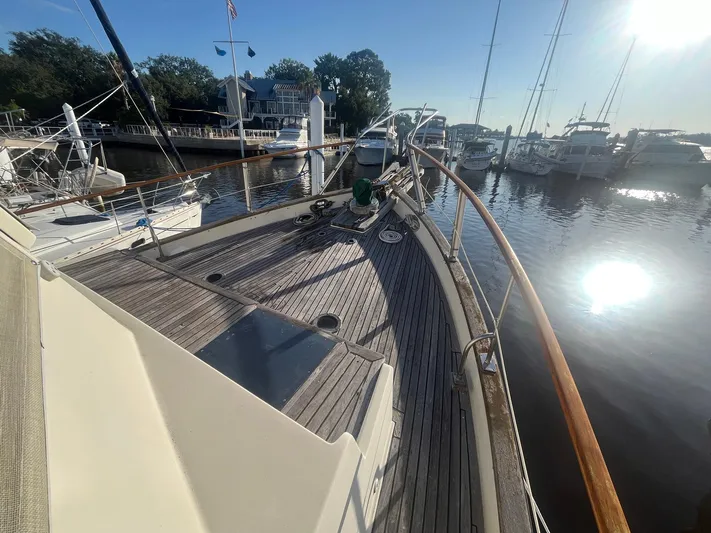 Anna Marie Yacht Photos Pics 1987 Kadey-Krogen 42 yacht docked at marina, sunny day, wooden deck, calm water.