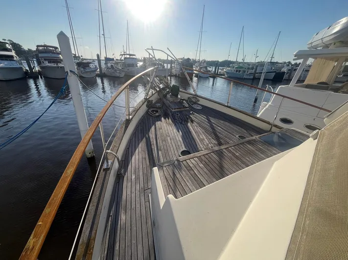 Anna Marie Yacht Photos Pics 1987 Kadey-Krogen 42 yacht deck at marina, sunlit with surrounding boats.