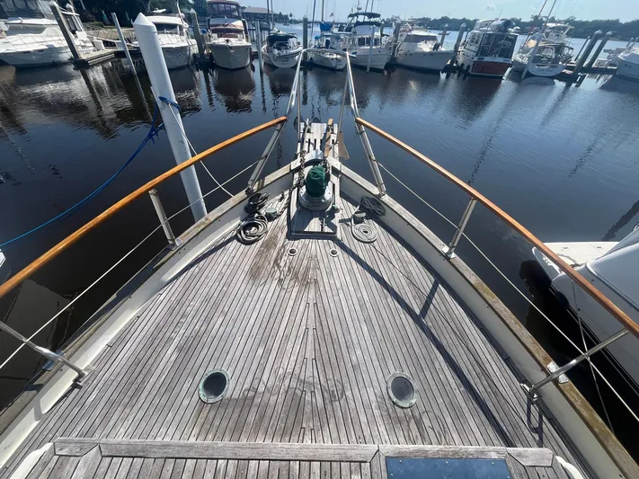 Anna Marie Yacht Photos Pics Bow view of 1987 Kadey-Krogen 42 yacht docked at marina with surrounding boats.