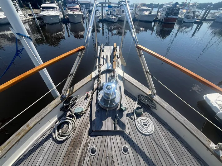 Anna Marie Yacht Photos Pics Bow view of 1987 Kadey-Krogen 42 yacht docked at marina, showcasing deck details.